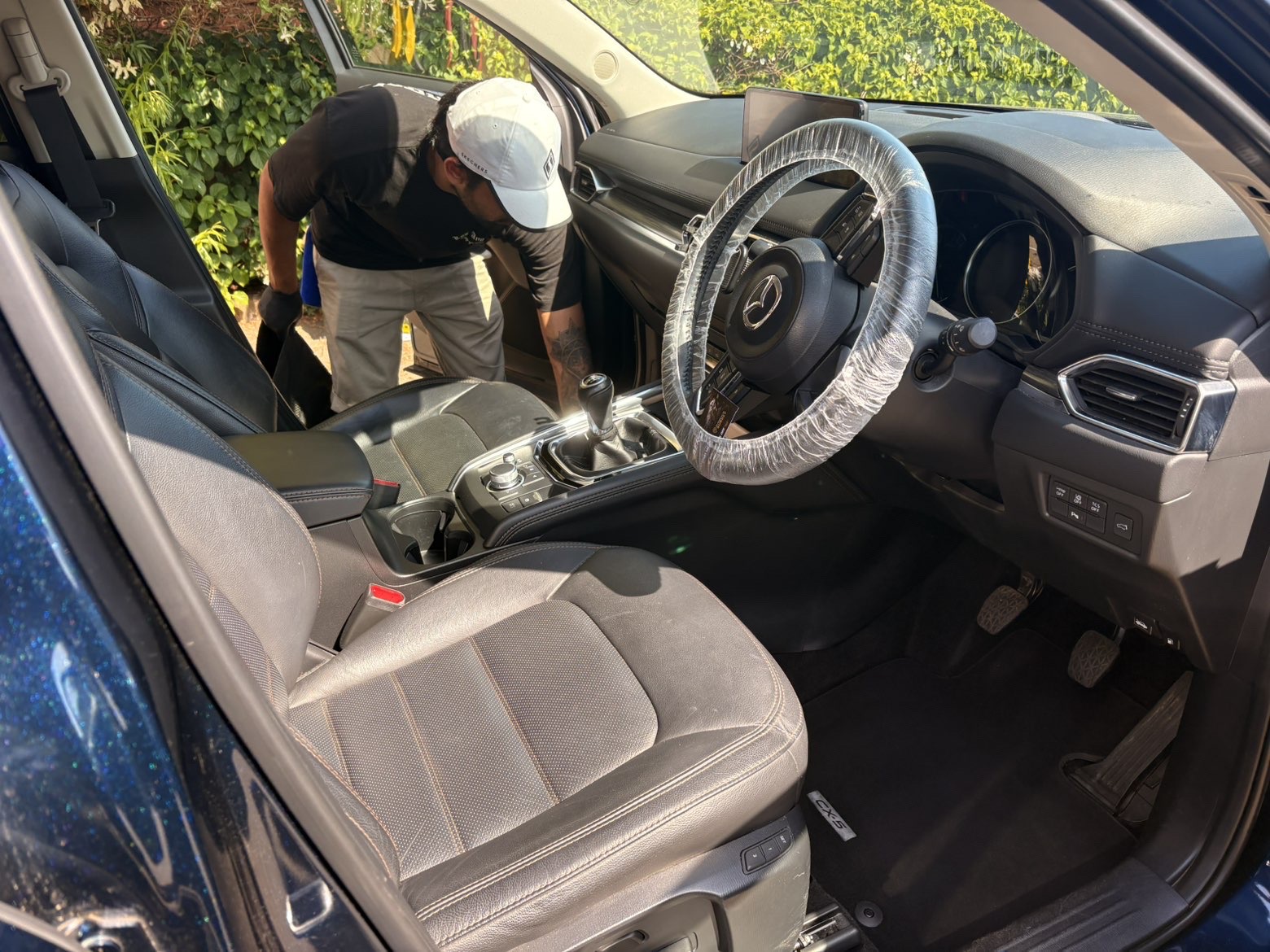 Aero detailer deep cleaning the interior of a Mazda CX-5
