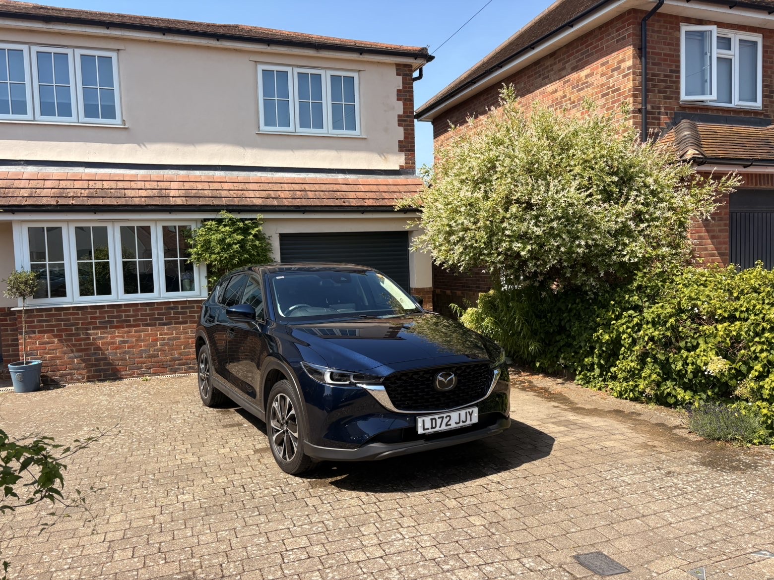 Deep blue Mazda CX-5 gleaming after a full exterior valet